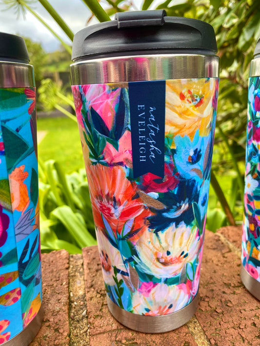 A thermal flask featuring a vibrant floral painting design, titled "Fresh Excitement." The design includes colourful flowers and delicate greenery, evoking a sense of energy and freshness.
